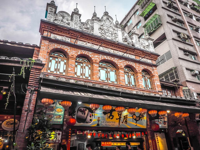 Exterior of a red brick building housing a restaurant on the Old Street in Shenkeng