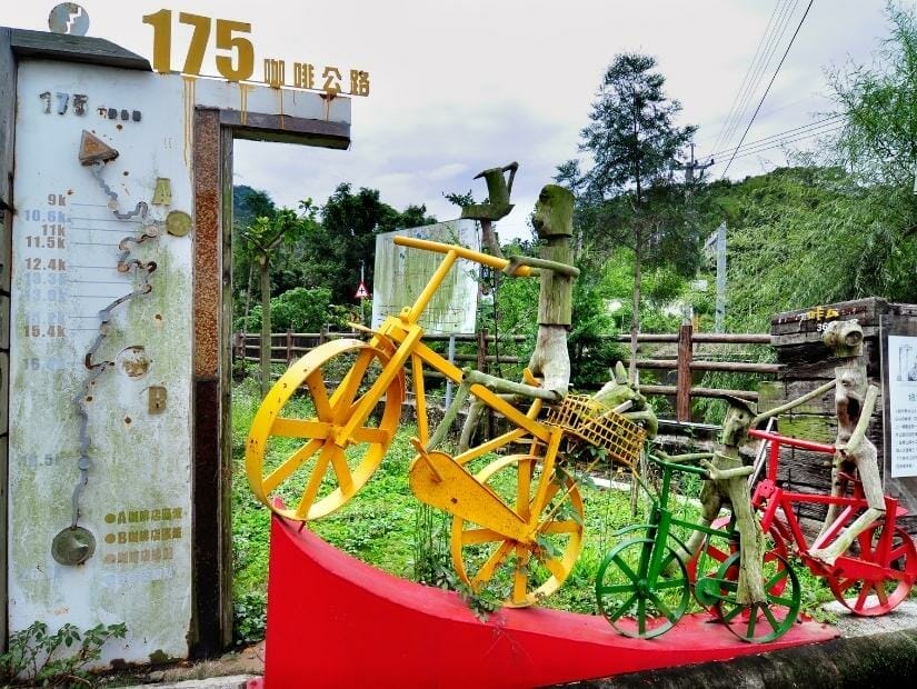 A sign and bicycle art installation on Dongshan Coffee Road in Tainan