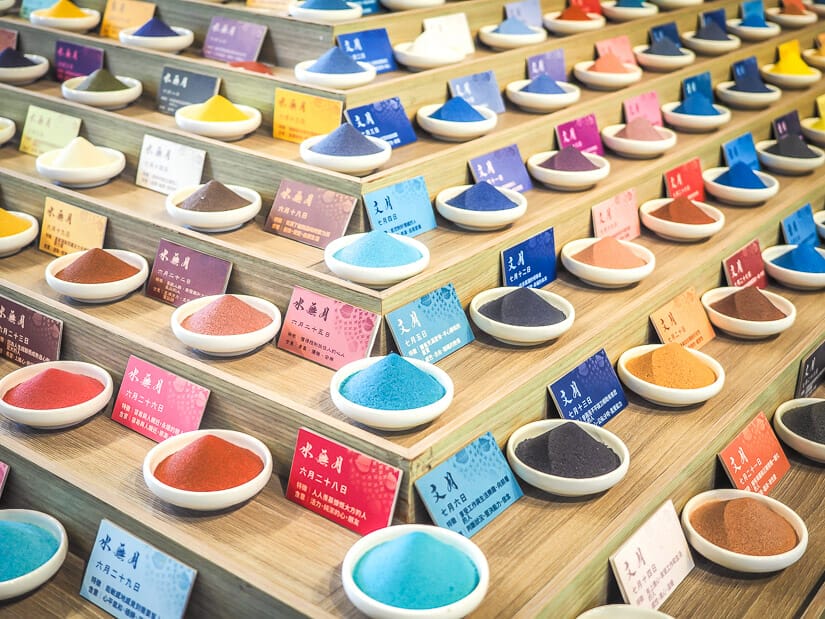 Shelves with bowls containing various colors of salt at the Sio House Salt Museum in Anping