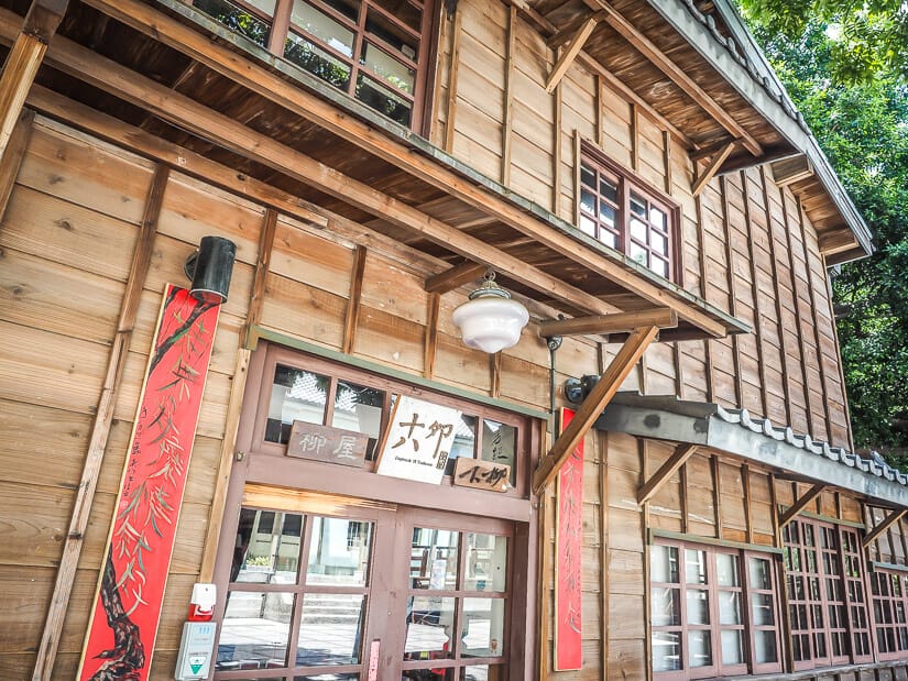 The exterior of a traditional wooden teahouse in Wu Garden, Tainan