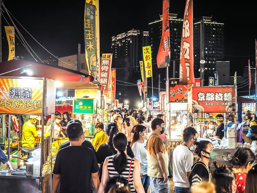 Crowds of people between food stalls at Wusheng Night Market