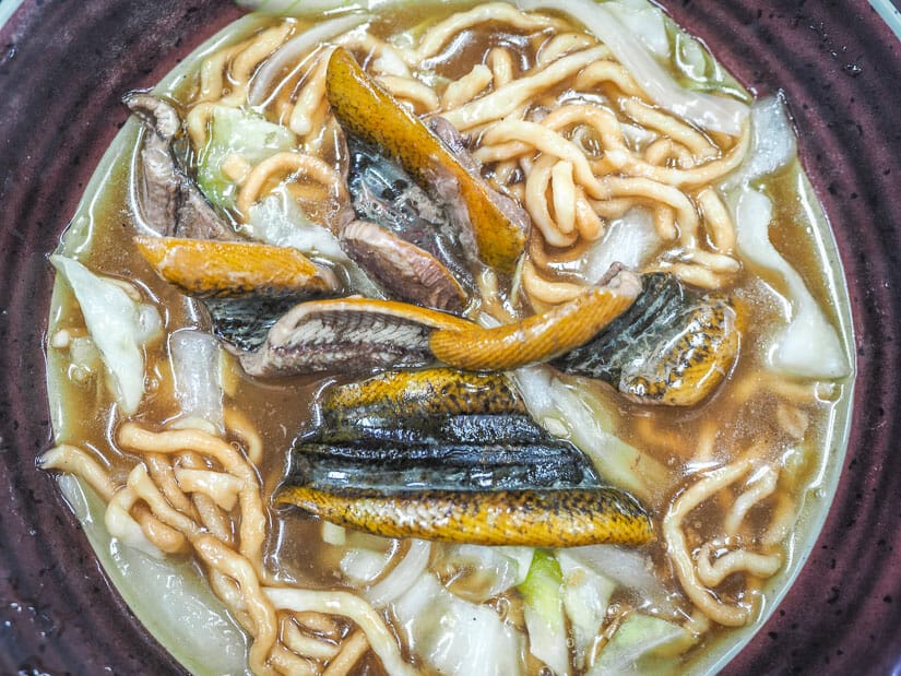 Close up of a bowl of eel noodles