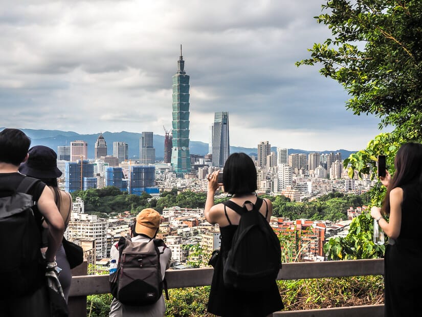 Some people taking photos of the view at Fuzhoushan trail Taipei