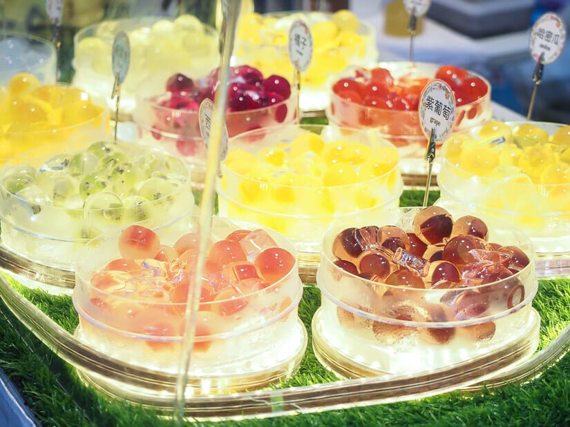 Bowls of colorful jelly desserts on display at Dadong Night Market