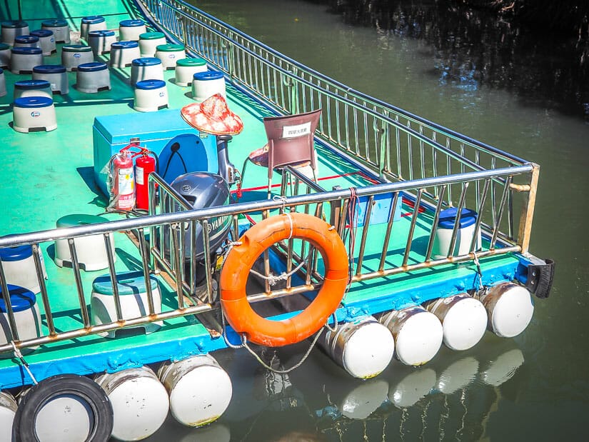 A raft used for Sicao Green Tunnel tours, with small plastic stools on it
