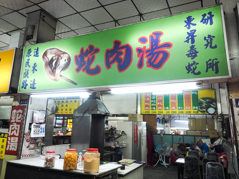 A night market sign saying snake meat soup in Mandarin characters