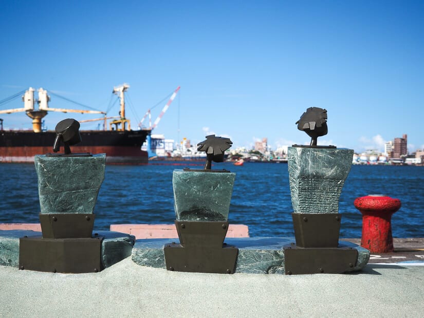 Three statues facing Kaohsiung Port at Pier 2 Art Center