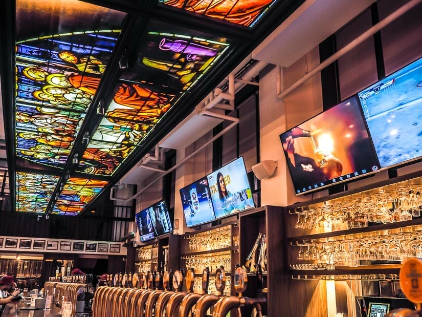 A craft beer bar on Pier 2 with a glass mosaic of Jesus and the disciples above the bar