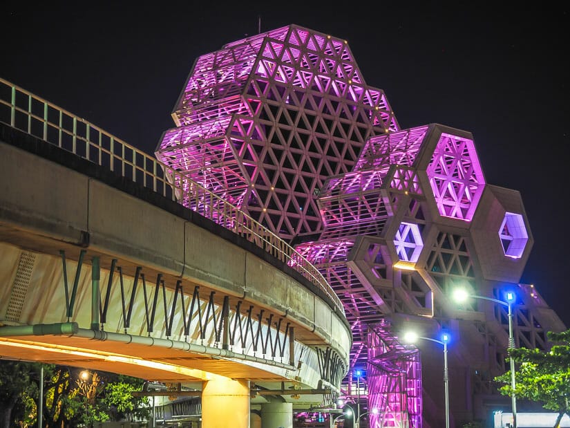 Kaohsiung Music Center lit up with purple lights at night