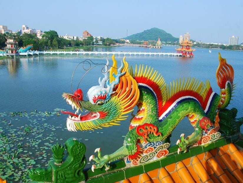 Several temples along Lotus Pond in Kaohsiung, with a colorful dragon in the foreground