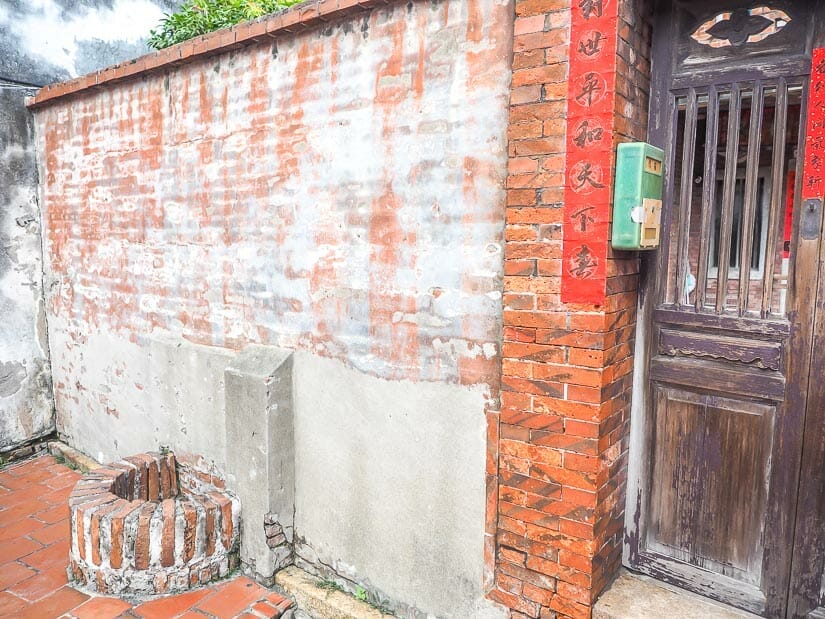 A red brick wall with a half well on Lukang Old Street