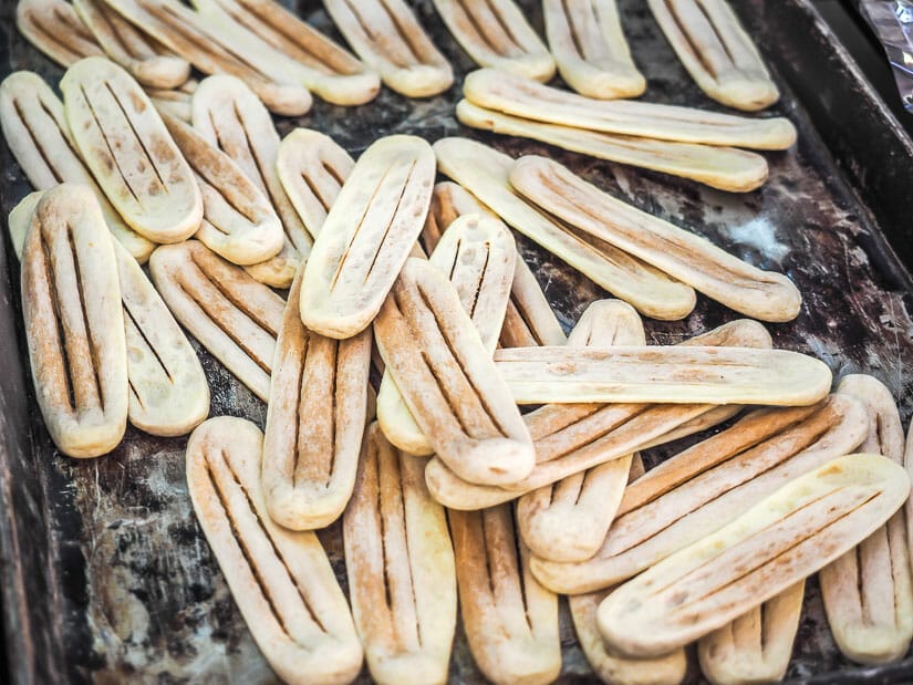 A bunch of ox tongue cookies on a platter
