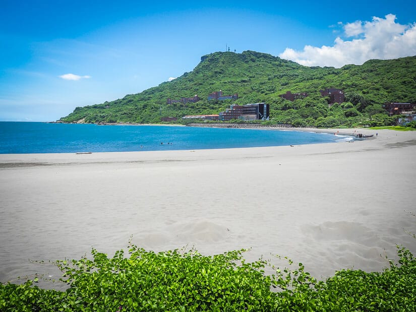 A black sand beach and bay at Sizihwan Beach in Kaohsiung
