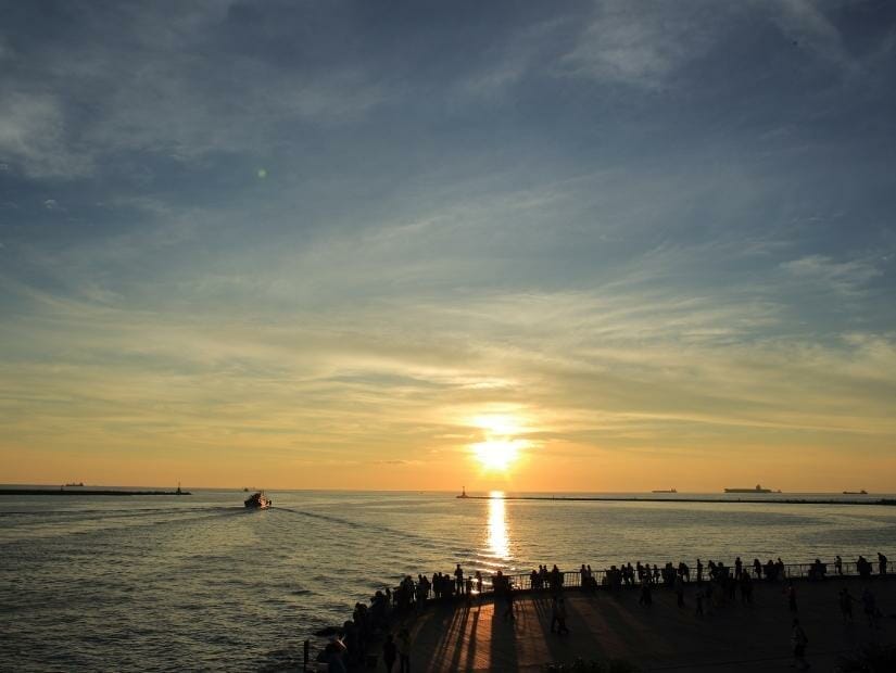 The sun setting beyond the entrance to Kaohsiung Port at Sizihwan Lookout
