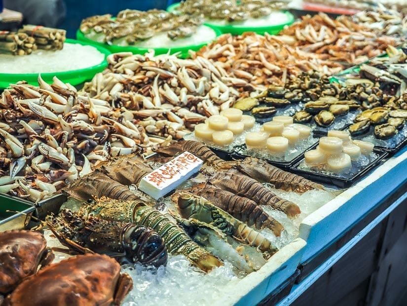 Fresh lobsters, scallops, and other seafood on ice on display at Wuqi Fishing Harbor in Taichung