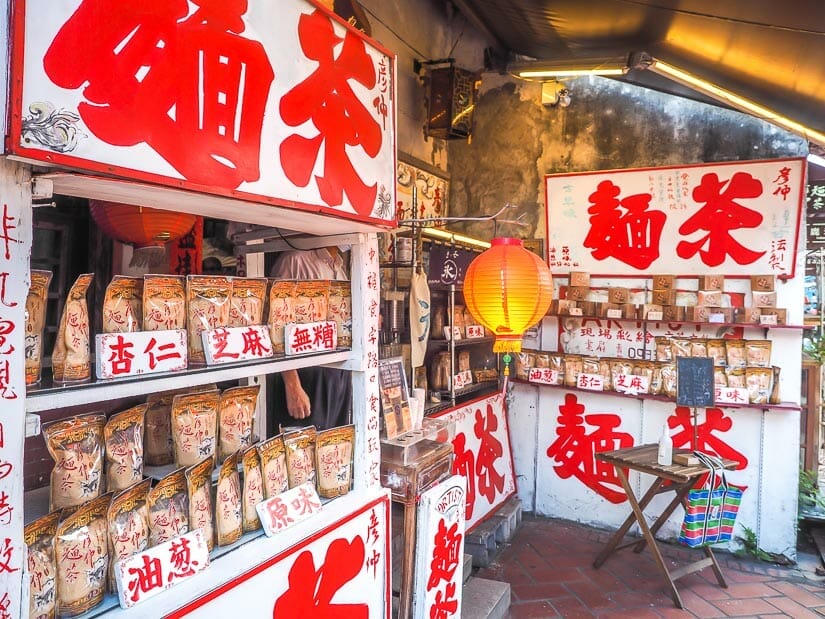 White food stalls with Chinese characters written in red on Lukang Old Street
