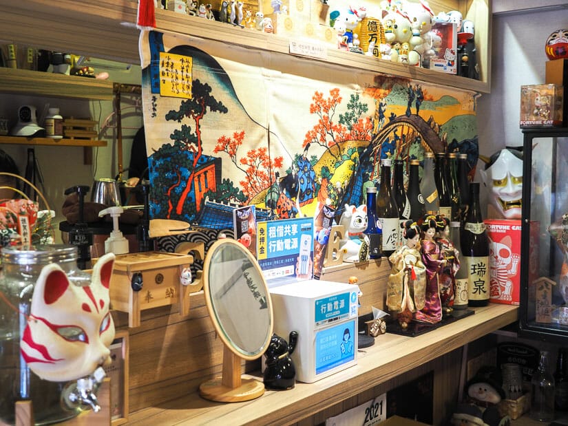 A bar in Nezo cat cafe, Taipei with lots of Japanese decorations