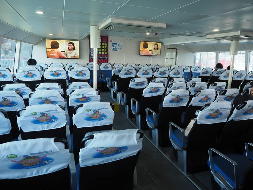Inside the ferry to Xiaoliuqiu, viewing the backs of many chairs