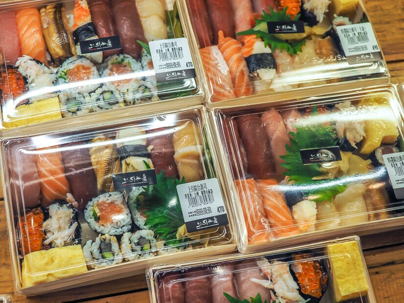 Close up of several trays of fresh sashimi for sale at Addiction Aquatic Development