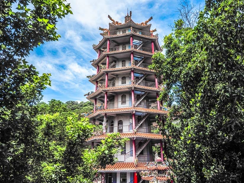 A tall, colorful Taiwanese pagoda in Liyushan Park, Taitung, with trees around it
