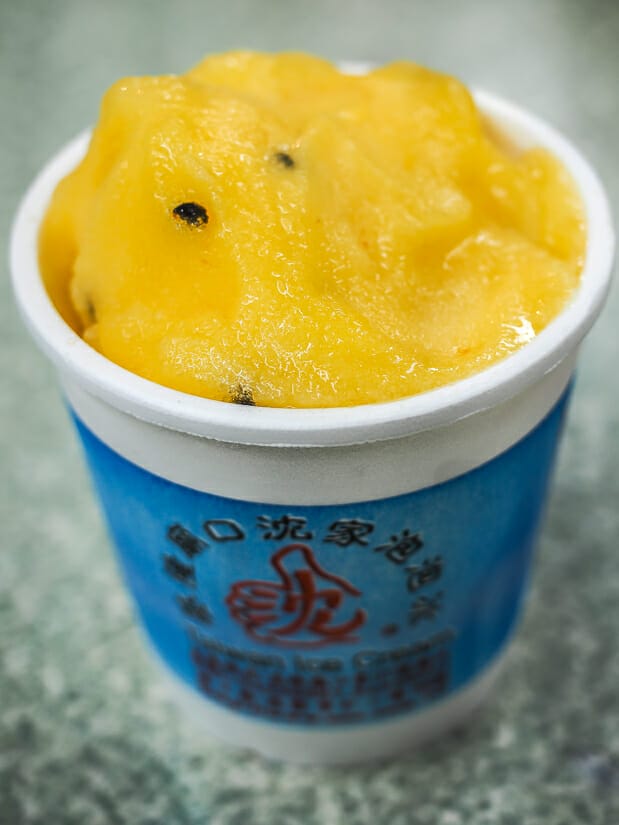A tall cup of passion fruit flavored pao pao bing, a kind of ice cream, served in Keelung Night Market