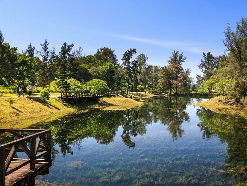 A wooden pavilion looking over the clear water of Pipa Lake in Taitung Forest Park