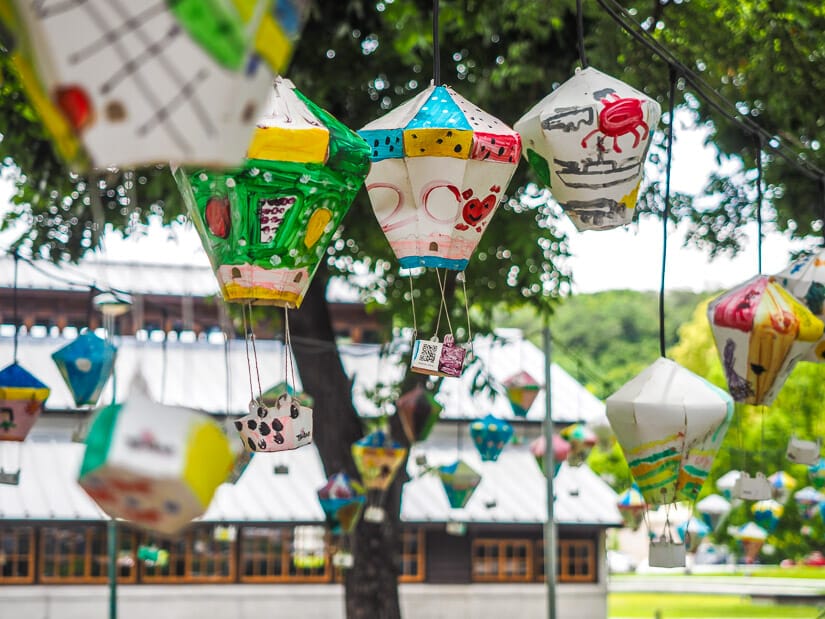 Some colorful lanterns hanging from a tree at Taitung Railway Art Village