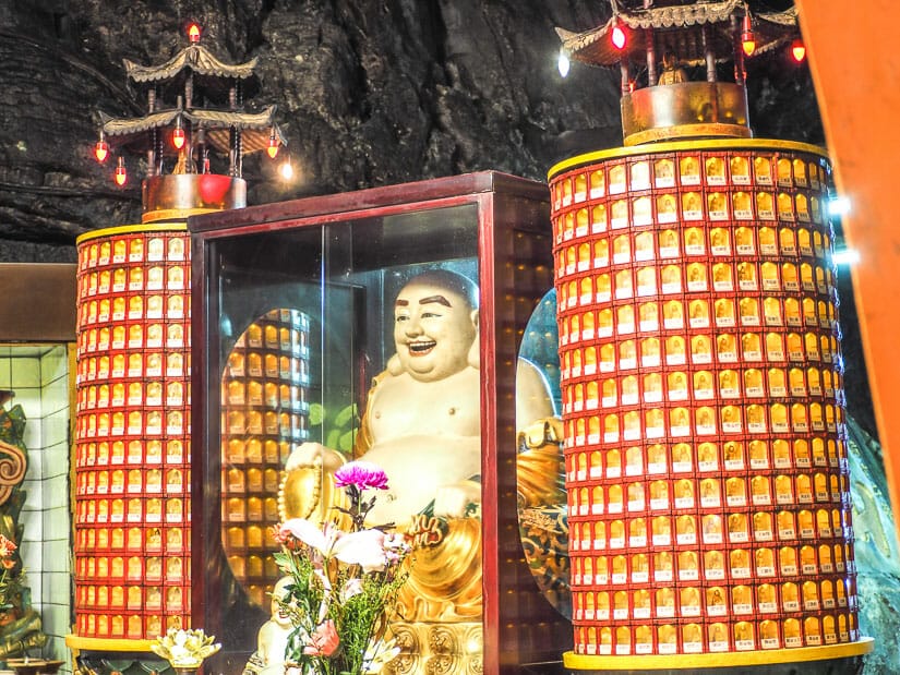 A fat Buddha on a shrine inside Fairy Cave Temple in Keelung