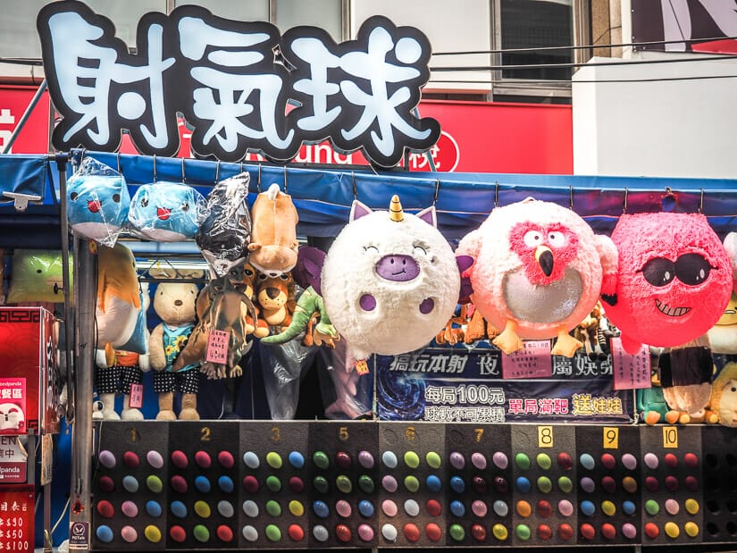 A balloon game with huge stuffies as prizes in Taichung's Yizhong Street Night Market