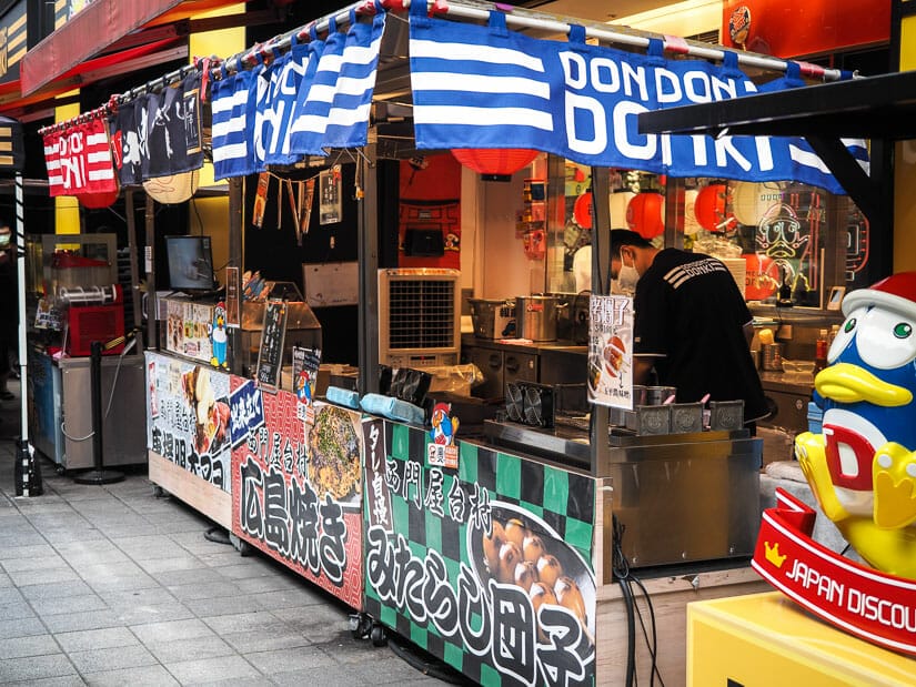 Japanese street food stalls in front of Don Don Donki department store in Ximending