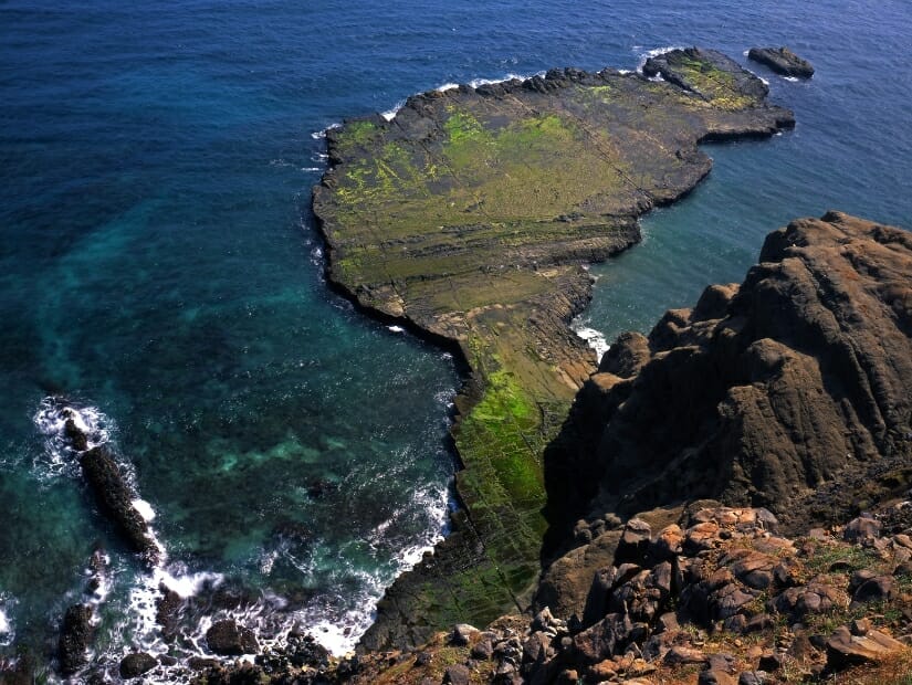 A flat stone islet that looks like Taiwan on Qimei Island in Penghu