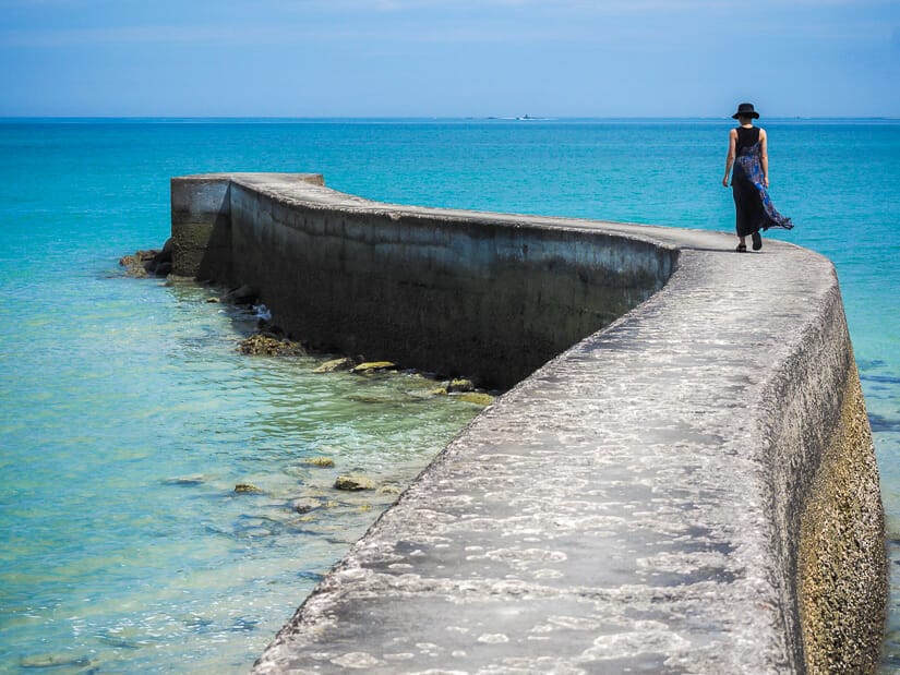 A Taiwanese woman in a sundress walking down Penghu Houliao Paradise Road