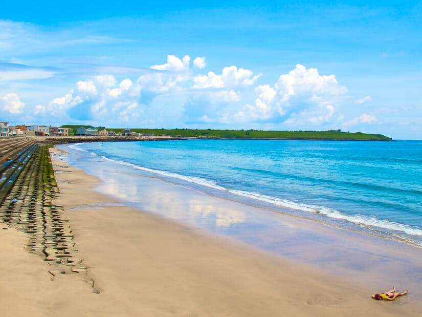 A girl suntanning on Shili beach in Penghu