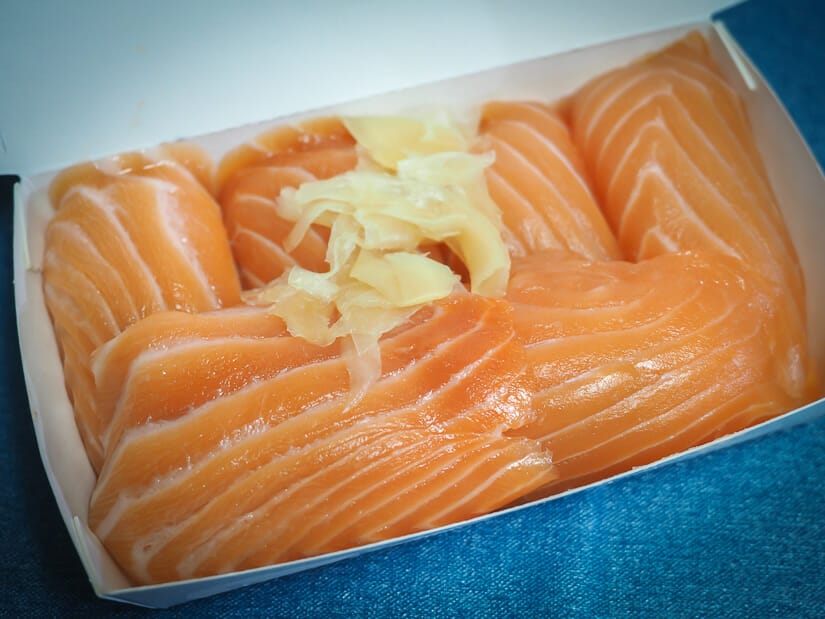 A white take-away food tray containing massive salmon sushis from Sun Way restaurant Ximending