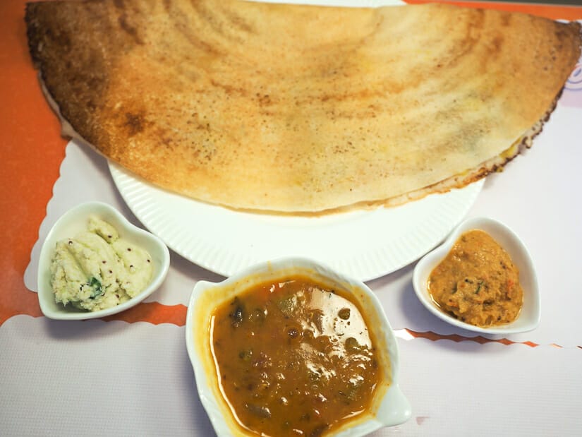 A large dosa with three dipping sauces on the table at Taipei's only south indian restaurant