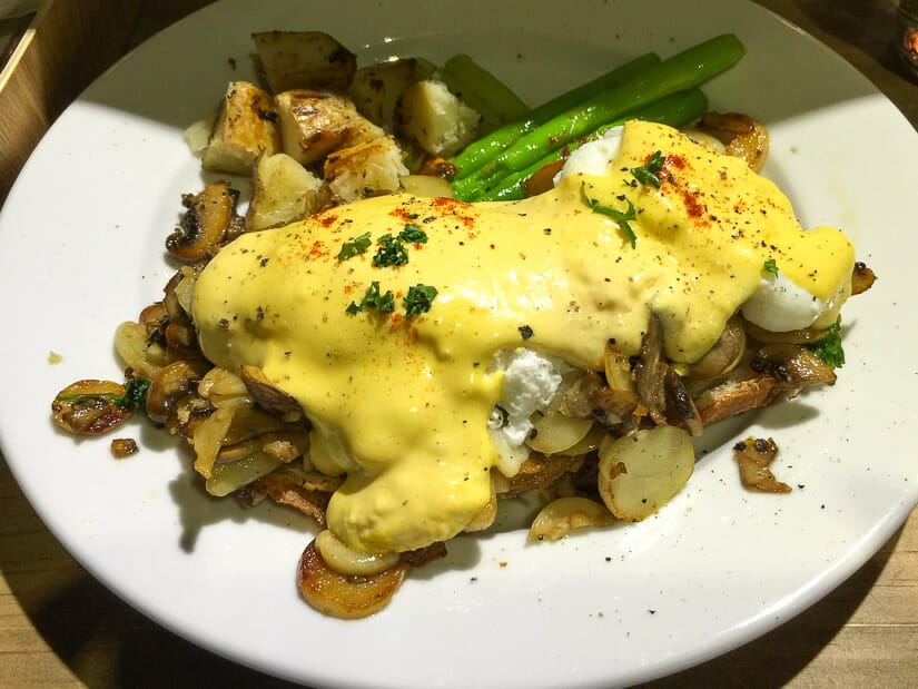 A plate of breakfast covered in Hollandaise sauce at Miacucina vegetarian restaurant in Taipei