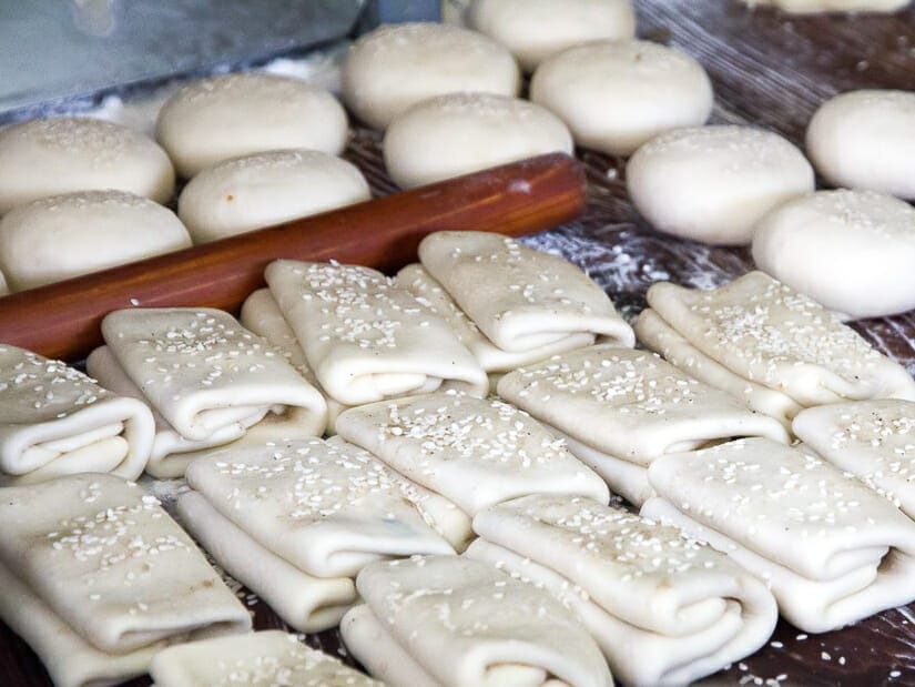 A tray of shaobing ready to go in the oven at a breakfast shop in Taipei