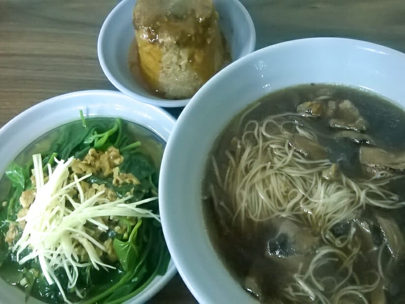 Three bowls of vegetarian food in a restaurant near Taipei Main Station