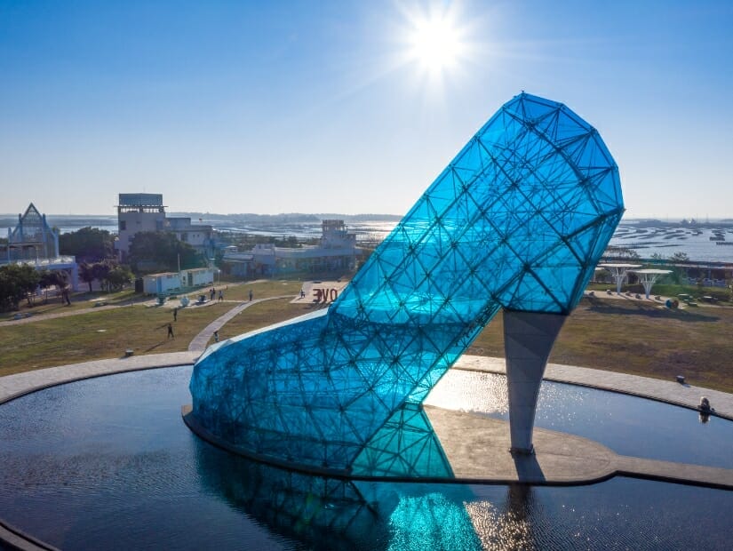 A blue high-heel-shaped church made of glass in Chiayi