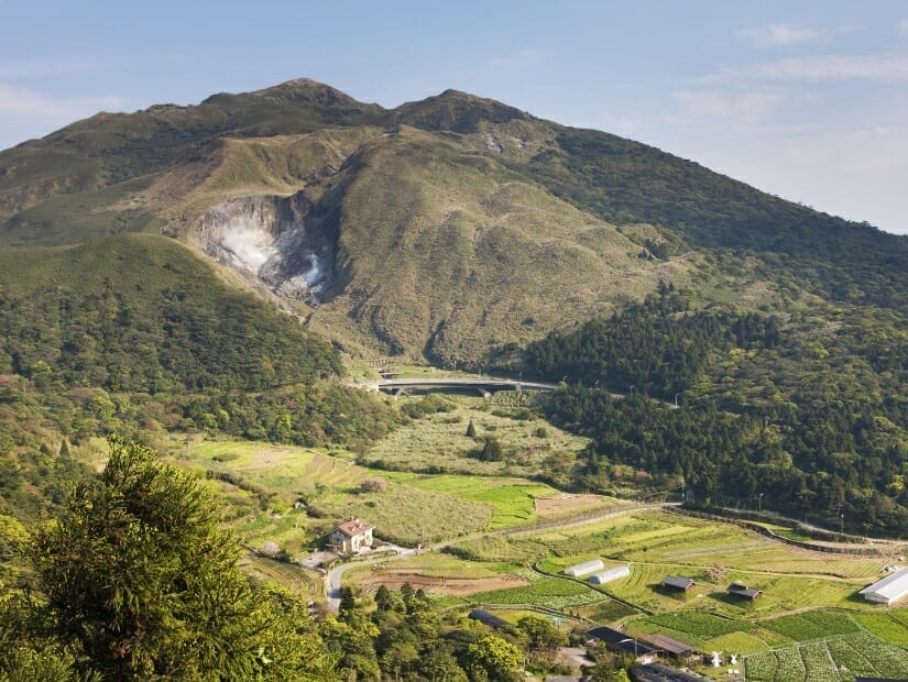 Farm at Zhuzihu with Yangmingshan mountain behind it
