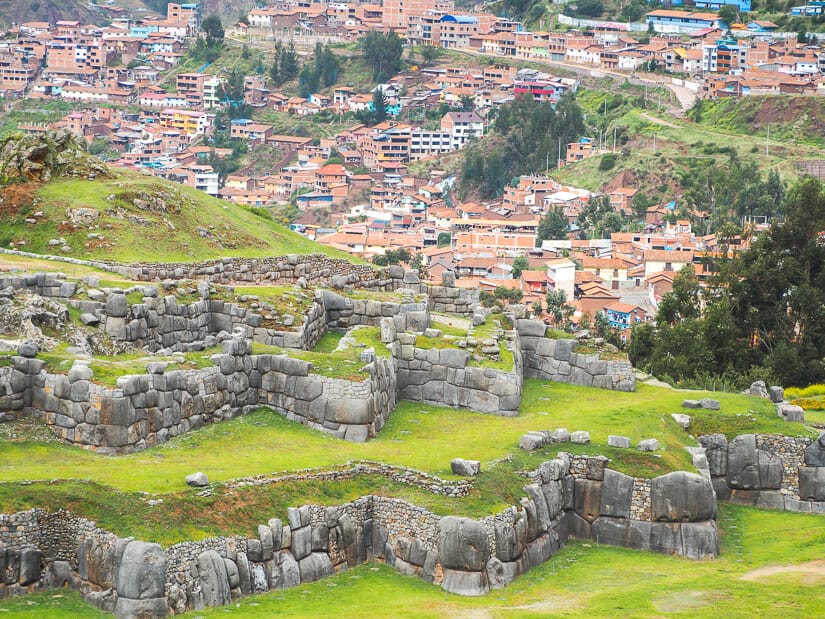 Aerial view of Sacsayhuaman ruins near Cusco, with houses of Cusco visible in background