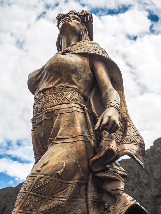 Close up of a bronze statue of the wife of Manco Inca in Ollantaytambo