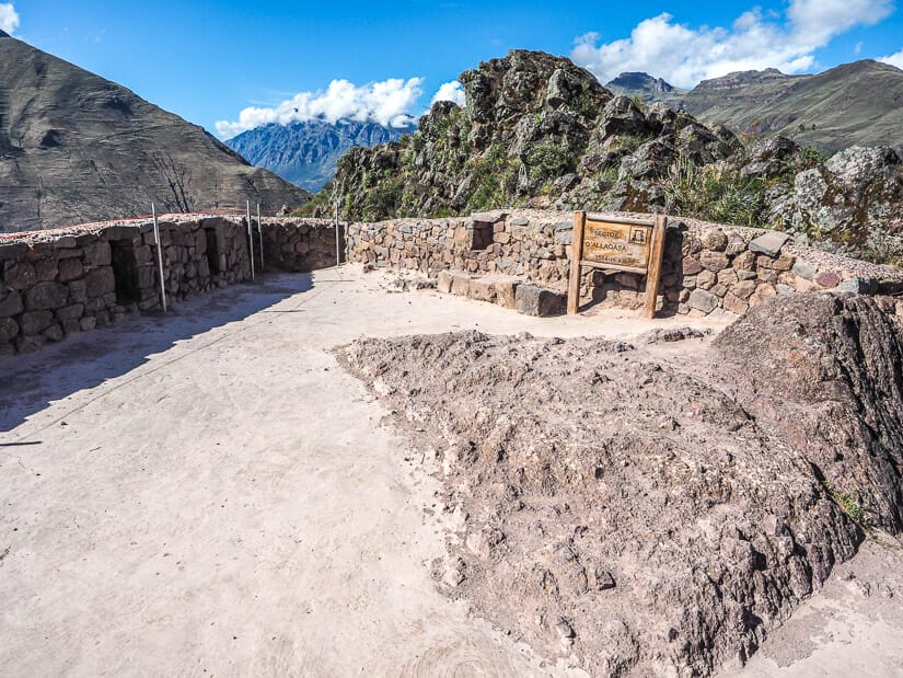 A round, flat, lookout tower with niches in its walls at the top of Pisac Ruins