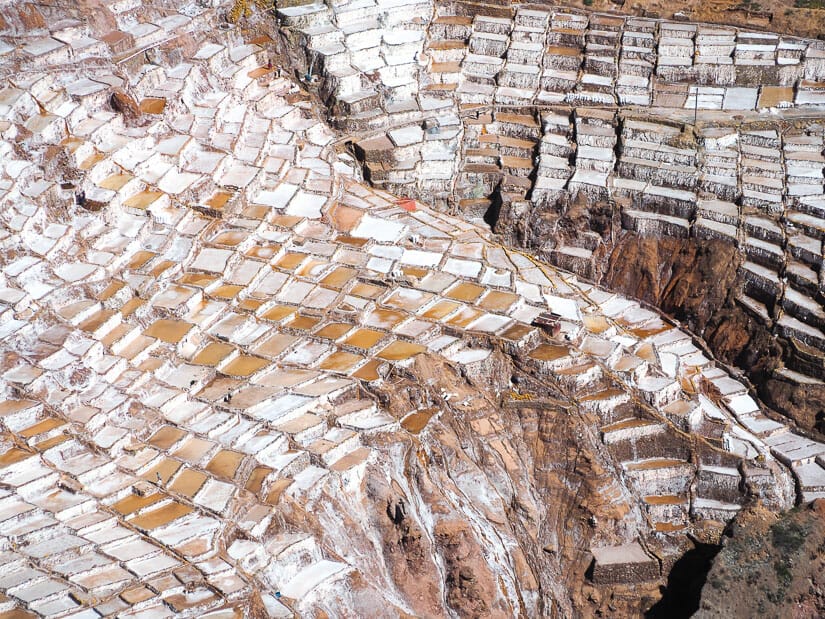 View of many salt terraces at Salineras Salt Mines in Maras