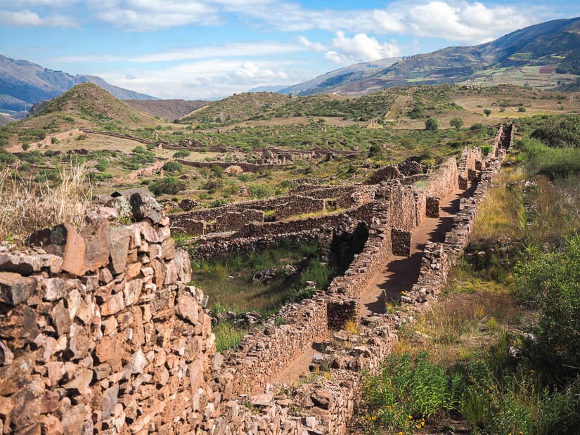 A very long stone wall at Pikillacta ruins near Cusco