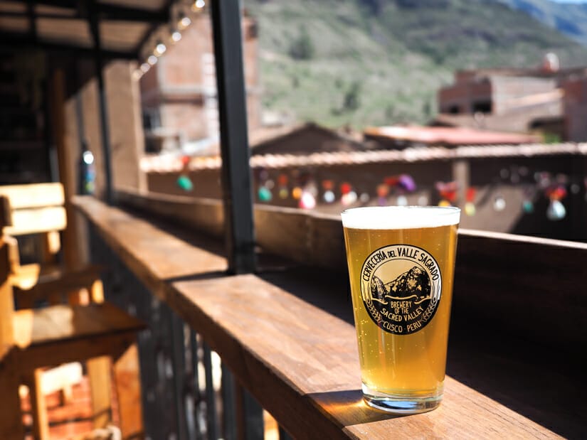 A pint of beer on a balcony inside Sacred Valley Brewery Pisac