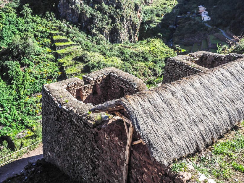 Tatched hut ruins facing T'antana Marka, the Inca cemetery at Pisac