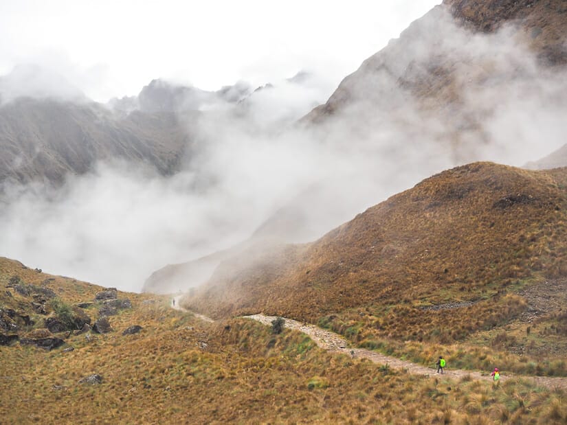 A trail descending through misty clouds