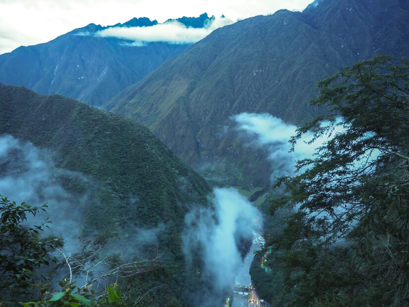 A valley with a hydroelectric station on the river