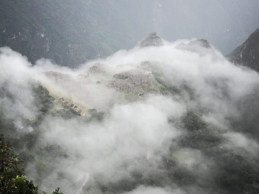 Machu Picchu ruins covered in clouds